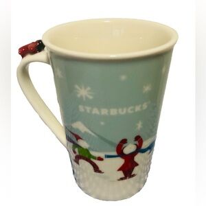 STARBUCKS 2011 Coffee Holiday Mug Winter Sledding Ice Skating Snow Airplane Dog